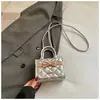 Textura retro minimalista 2026 primavera nuevo elegante de alta moda bandolera de un solo hombro para mujer con lazo