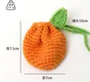 Bolsa de camélia de tricô de lã feita à mão bolso de roupa chapéu laranja cartão de cabelo joia tecida acabada venda quente transfronteiriça