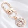 Lujo Ligero Chapado en Oro Full Diamante Charm Hebilla en Forma de D Colgante Hueco en Forma de Corazón Accesorios para Bolsos Llaves Fábrica Stock Mayorista