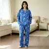 Pijama a la ModaNuevo pijama para mujer, imitación algodón, doble bolsillo, cuello redondo, manga larga, diseño de dibujos animados, conjunto holgado para casa para primavera y otoño