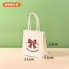 En stock: Bolsa de lona con diseño de Santa Claus para Navidad, bolsa de regalo, recuerdo de fiesta navideña, bolso de mano festivo
