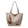 A Bolsa Sacola Casual e Simples Popular Deste Ano para Sala de Aula de Estudantes é uma Bolsa de Ombro Leve da Moda de Grande Capacidade Estilo Executivo para Mulheres