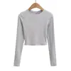 Chica atractiva cuello redondo elástica ajuste ceñido Sexy espalda descubierta con tiras cruzadas manga larga Camiseta corta ajustada para mujer