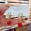 Pendientes colgantes de perlas rojas festivas de Corea del Sur, elegantes pendientes de aguja de plata de celebridades de Internet personalizados para otoño e invierno, pendientes de Año Nuevo