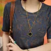 7356# Top Casual de Manga Corta con Cuello Redondo y Estampado Elegante Verano Nuevo Estilo Ropa para Madres Estilo Delgado Cubre-Gorditos