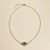 Collar de doble capa europeo y americano para mujer, cadena vintage triangular dentada para clavícula con colgante de ojo turco azul, accesorio versátil