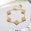 Pulsera de trébol de cuatro hojas de doble cara con incrustaciones de diamantes del fabricante, joyería de acero de titanio 18k para mujer de la suerte, no se decolora, producto más vendido transfronterizo