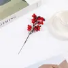 Comercio electrónico transfronterizo Flor de simulación 12 Fruta de acebo Copo de nieve Baya roja Cubeta Joyería Fruta de la fortuna de Año Nuevo Fruta navideña