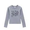 Blusa Branca de Algodão Puro com Manga Longa para Mulheres 2025 Nova Coleção Início da Primavera Estilo Simples Estampa de Desenho Animado Camada Interna Modelagem Justa Camisa Básica para Mulheres