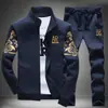 Conjunto informal de moda unisex europeo para otoño e invierno con sudadera con capucha estampada y pantalón deportivo con cordón