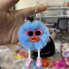 Colgante llavero de bola de carbón pequeña de felpa colorida en stock del fabricante, juguete divertido de dibujos animados para decoración de mochila, colgante de bola de pelo