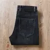 Estación europea otoño e invierno grueso lavado desgastado algodón microelástico cintura media-alta ajuste casual recto hombres Jeans