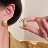 Pendientes en forma de U con textura transfronteriza europea y americana, pendientes geométricos de metal combinables, pendientes cuadrados avanzados de doble cara.