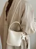 Bolso tipo cubo retro simple Shuai Mi Jia para mujer, nuevo bolso de moda para el hombro o cruzado de principios de otoño de 2026, bolso casual para el día a día