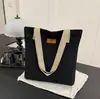 Bolso de mujer 2026 nuevo modelo de lona para escuela y para ir al trabajo, bolso tote de nicho de gran capacidad para portátil, bolso de lona