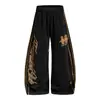 OREETA Estilo Jersey Americano Estampado de Leopardo Patchwork Raya Pantalones Deportivos Casuales Unisex Marca de Moda Pierna Ancha Suelta Pantalones Plátano