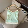 Camisola de malla con encaje y patchwork en V, ajustada, corta, con detalle de lazo, perfecta para llevar sobre una camiseta de malla