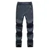 Pantalones softshell suaves al por mayor para deportes al aire libre para hombre, corte ajustado, engrosados, nuevos pantalones softshell de forro polar para otoño e invierno, pantalones de senderismo para mujer