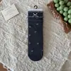 Calcetines de altura media con estampado floral y lazo de burbuja estilo coreano Peiqiao, dulces y femeninos, calcetines sin costuras de algodón puro, venta al por mayor de la industria del calcetín de Zhuji