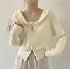 Chaqueta suéter con capucha de doble cremallera corta chic coreana para mujer 2026 estilo suave color liso prenda exterior de punto