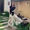 Verão 2026 Nova Moda Casual Juvenil Emagrecedor Estiloso Versátil Irregular Camiseta Curta e Conjunto de Calça Wide-Leg Tendência