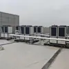 Unidad de Agua Caliente con Bomba de Calor de Fuente de Aire Comercial Combinada con Colector Solar de Tubo de Vacío Sistema de Agua Caliente Fabricante Suministro