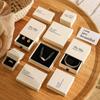 En stock al por mayor caja de almacenamiento de joyas color blanco tierra estilo ins papel especial de alta calidad caja de embalaje de cajón de joyas con tapa cielo y tierra