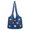 Bolsa de punto calada de nuevo estilo para el verano 2025, bolsa tejida de un solo hombro, gran capacidad, para el trabajo, bolsa tote floral de alta gama para mujer