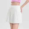 Nueva falda de tenis talla grande para mujer, falda plisada blanca de secado rápido, minifalda deportiva, media falda de bádminton anti-exposición, ropa de tenis