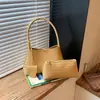 Bolsa de mão com design exclusivo para mulheres, novo modelo 2026, bolsa de ombro única, transversal, de axila, sensação de luxo, bolsa de palha tecida para segurar na mão para mulheres