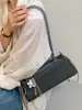 Elegante Bolso Baguette Xiaomi Coreano de Nicho Fresco Dulce Nuevo Otoño Temprano 2026 Bolso de Hombro de Alto Valor Simple para el Trabajo