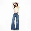 Jeans naranjas jóvenes # Acampanados con un corte ligeramente holgado, con acabado lavado y dobladillo deshilachado, diseñados para estilizar y ser elegantes, perfectos para un look moderno y versátil