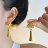 Pendientes de borlas con forma de sol retro, pendientes dorados para mujer, nuevo estilo 2026, diseño popular, que irradian un aspecto lujoso y deslumbrante