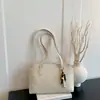 Bolso pequeño cuadrado transfronterizo moderno y elegante para mujer, nueva colección otoño 2026, color liso, bolso de hombro minimalista, adecuado para ir al trabajo y uso diario