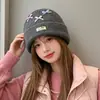 Gorro de punto estilo coreano, mezcla de lana, inspirado en la dopamina, con un lazo, diseñado para mujeres, que proporciona calidez y protección para los oídos en otoño e invierno, adecuado para estudiantes