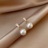 Nuevos aretes de tuerca de aguja de plata S925 de moda, aretes populares versátiles, joyería de temperamento simple y fresco de hadas al por mayor