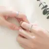 Anillo de Pareja Beso de Ángel Un par de anillos de boda para hombre y mujer sentido de diseño de fabricantes de anillos de nicho al por mayor