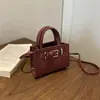 Primavera 2026 Nuevo Mini Moda Chic Pinzas Textura de Alta Calidad Simple Versátil Hombro Cruzado Bolso de Mano Kelly