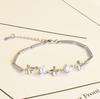 Pulsera temperamento cabello generación de fábrica damas pulsera de cristal en forma de corazón hueco pulsera coreana flor de coche diamante trébol de cuatro hojas