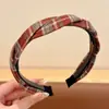 Diadema de lunares de alta gama coreana para mujer, diadema antideslizante de otoño e invierno, pinza para el pelo elegante para lavarse la cara, accesorio para el pelo versátil, venta al por mayor