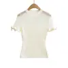 Nuevo estilo maduro y juvenil top de punto de manga corta con cuello redondo, diseño calado y lazo para mujer, estilo puro deseo, top sexy semi-transparente para chica caliente