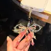 Cadena para Teléfono Móvil con Lazo de Perlas Super Hada Dulce Colorido Moda Femenina Lujo Accesible Colgante Corazón Girly Colgante Lindo Versátil
