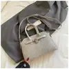 Bolsa pequena tecida com textura cruzada para mulheres 2026 novo estilo bolsa de mão para o trabalho e trajeto bolsa Kelly bolsa transversal estilosa