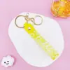 Chaveiro Pingente de Corda de Couro com Letra Transparente Brilhante com Acessórios Estilo Boneca Preenchida com Óleo Pingente de Chaveiro Pulseira Atacado