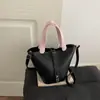 Bolso tipo cubo texturizado estilo western 2026 versión coreana verano nueva moda simple casual versátil bolso de hombro cruzado