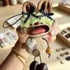 Encantador perrito peludo con la lengua fuera, llavero para bolso, colgante de dibujos animados natural, semillas de terapia de sonido curativas, popular en zonas escénicas, amuleto divertido y adorable