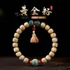 Hainan Semilla Dorada Cadena de Mano Grasa de Pollo Estrella Amarilla Luna Bodhi Madera de Durazno Flor de Loto Hombres y Mujeres Juego Cultural Pulsera de Cuentas Budistas Fabricante Mayorista