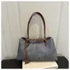 Bolso grande de leopardo transfronterizo para mujer, nuevo bolso de hombro versátil vintage primavera/verano 2026, bolso tote para el trabajo