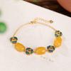 Pulsera Yilu de plata de ley S925 bañada en oro con superficie de huevo de flor de cloisonné de cera de abeja vintage, pulsera elegante y de moda