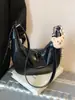 Bolsa de Dumpling Popular de Verano para Mujer 2025 Nueva Versátil Casual Bolso de Hombro Simple Color Puro Bolso Cruzado de Alta Gama